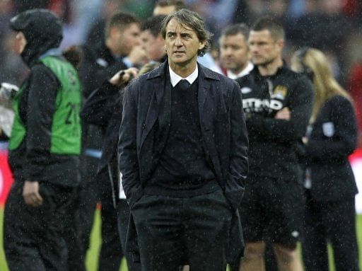 Manchester City manager Roberto Mancini reacts after his team's defeat in the FA Cup final against Wigan on May 11, 2013